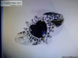 A VINTAGE Heart shaped Blue Sapphire Ring with Diamond Accents.