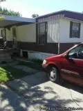 For sale. Brown double wide in oakridge estates.