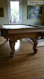 Pool table with pool sticks