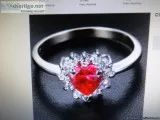 Heart Shaped Red Ruby Ring with White Topaz accents.