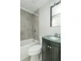 This great Two BR One BA sunny apartment is located in the Roxbu