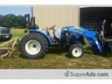 Brush hogging  4x4 tractor with front end loader and 5 ft brush 