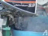 Johnson 15hp outboard with a 9.9 Hood -