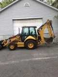 2010 Caterpillar 420E Backhoe Loader with forklift attachment