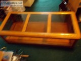 nice wood and glass coffee table on wheels