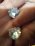 Selling new earrings and like new boot cut jeans in blue denim