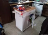 Movable chop block with storage.