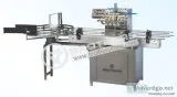 Linear tunnel bottle washing machine