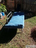 SOLIDLY BUILT FUTON WITH BLUE MATTRESS