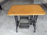 A sewing machine base with oak top