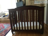 KidsCraft portable cherry wood crib