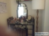 Black vanity with chair and mirror
