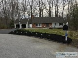 Immaculately maintained Rancher with an acre of private forest