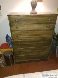 2 dressers and a rocking chair.