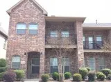Large master suite features private balcony