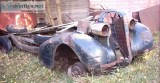 1937 Buick Chassis Frame has motor on 3 wheel rims
