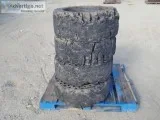 (4) RIMS WSOLID TIRES fits skidsteer