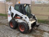 Bobcat Skidloader S185 with Bucket Blade and Sweeper Attachment