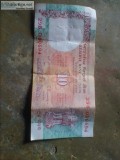 5 rupee old note and coins