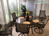 Glass top patio table w6 swivel chairs