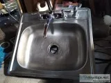 Stainless steel kitchen sink with Moen faucet