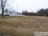   COUNTRY 1 ACRE LOT WITH MOBILE HOME AND GARAGE 