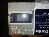 New white Danby 0.7cu ft microwave in opened box 50cash