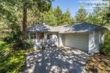 Fantastic single level home on a large with large wood-framed wi