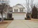 Spacious rooms with carpet and hardwood floors and a fireplace. 