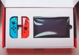 Nintendo Switch with neon red and neon blue JoyCon - Version 2 3