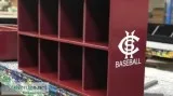 All different sizes of baseball helmet racks