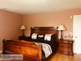 Big furnished bedroom with walk-in closet in the house