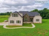 Beautiful All Brick Home situated on more than 2 acres of privat