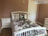 Furnished bedroom with walking closet in the house