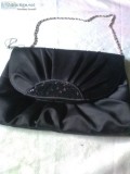 Black clutch bag or wear with the silver strap.