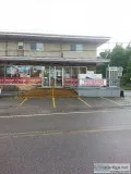 Semi-commercial bullding with convenience store and large apartm