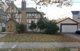 ID  (ELA) Lovely Tudor Style Stucco Home on Oversized Lot
