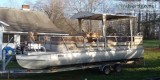 24  Pontoon boat with trailer