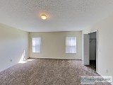 Sleek tile and plush carpet floors are found throughout