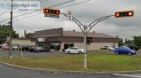 Commercial building on busy street corner in Ste-Julie