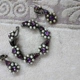 purple and white bracelet with earrings.