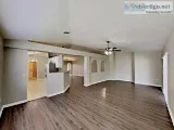 This property features a two-car garage with gorgeous palm trees