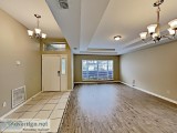 The lovely kitchen has stainless steel appliances