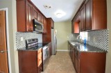 Let The Cherry Cabinets Bring Warmth To Your Kitchen