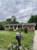 Lovely 3br 1ba home sits on a large lot with luscious landscapin