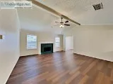 The interior features stylish laminate flooring and carpeting th