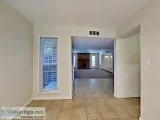 Tile and carpet flooring and modern hardware are found throughou