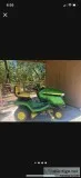 John Deere mower and trailer