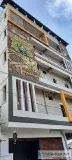 painting mural on building exterior wall