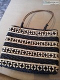 Woven handbag with handles